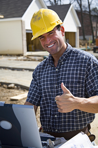 Satisfied contractor giving thumbs up